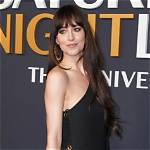 Dakota Johnson Rocks a Black Bikini at a Beach While Beau Chris Martin Plays with Son Moses